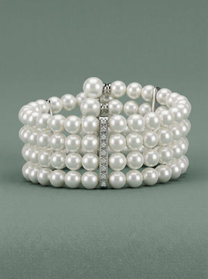 brazalete de perlas blancas con apliques de plata y circonitas