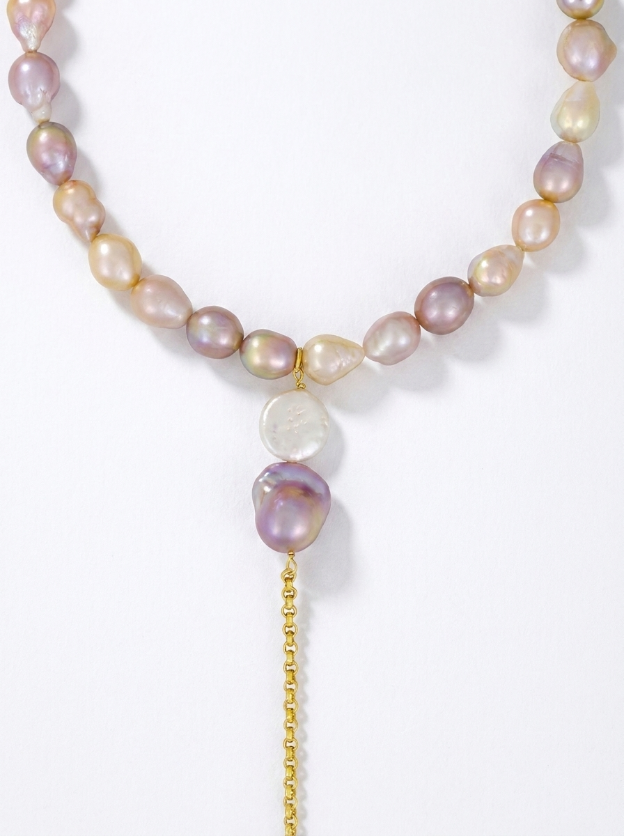 Close-up of a choker with a long chain
