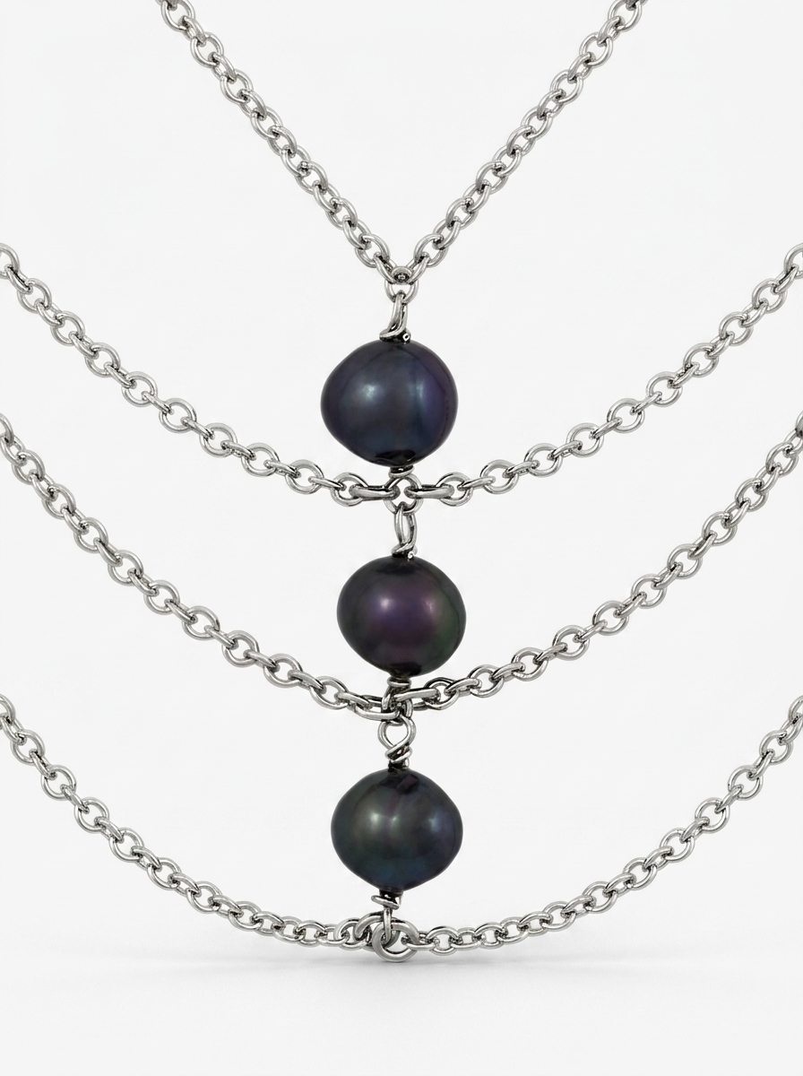 Centre of a necklace with black pearls