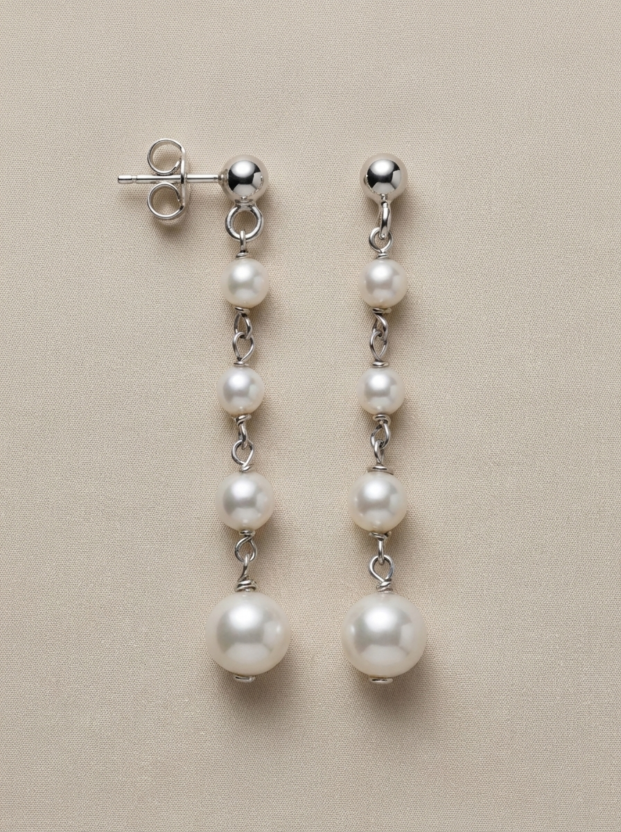 arracades llargues de perles combinades amb plata 