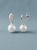 Cubic zirconia and silver earrings with a white pearl