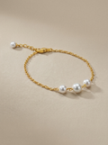 Pulsera de tres perlas blancas