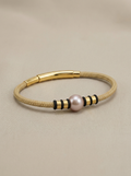 Beige cord bracelet with a copper pearl