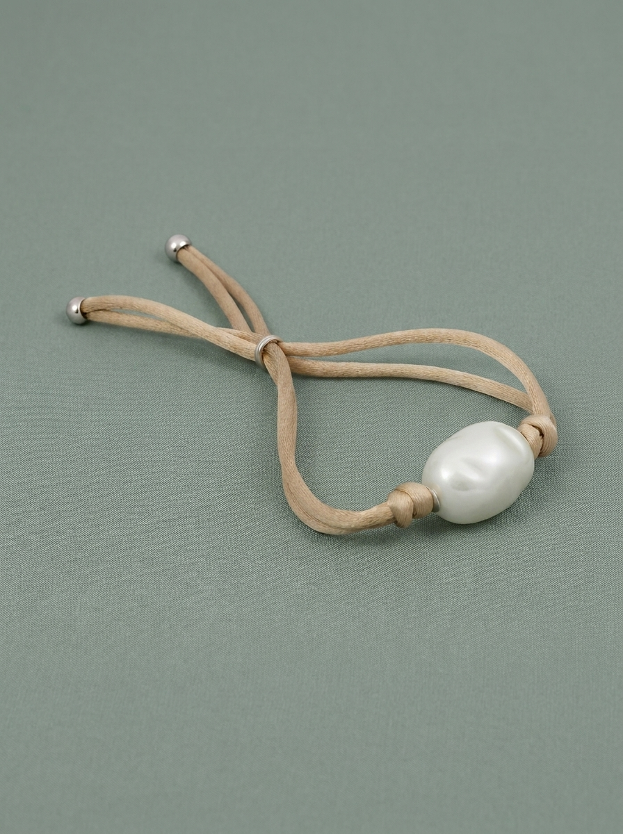 Bracelet en cordon avec perle blanche