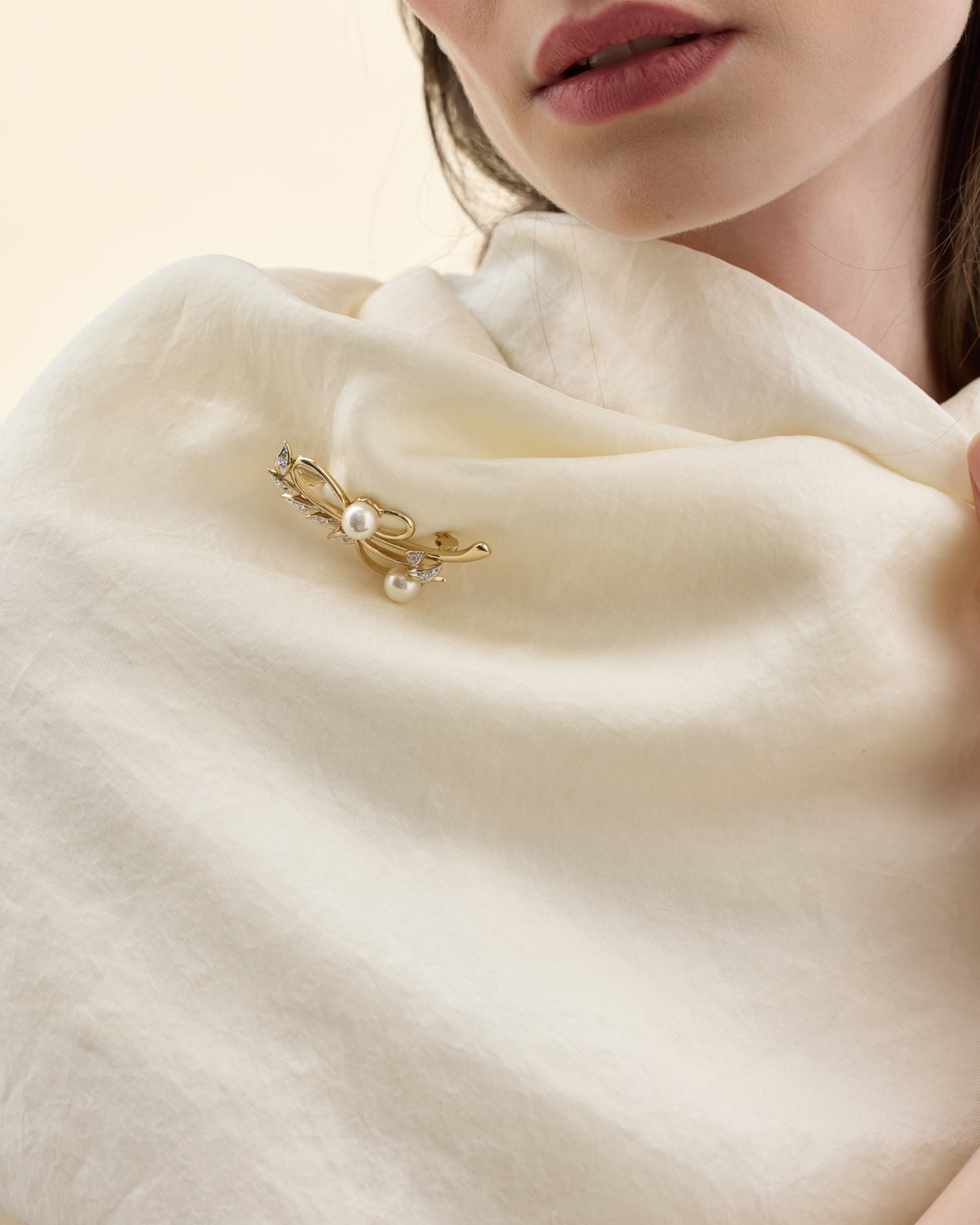 Model wearing a pearl brooch