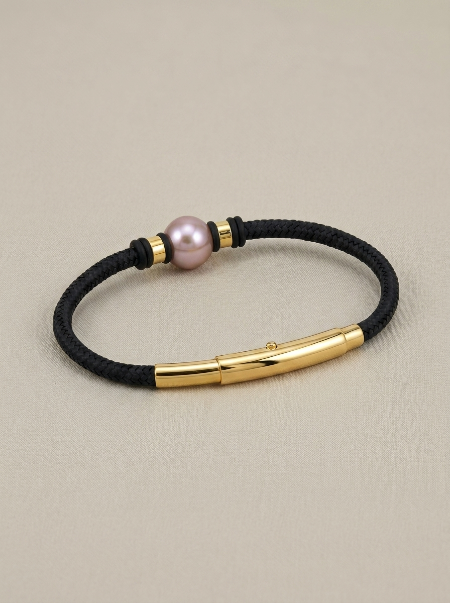 Gold-tone cord bracelet with a copper pearl