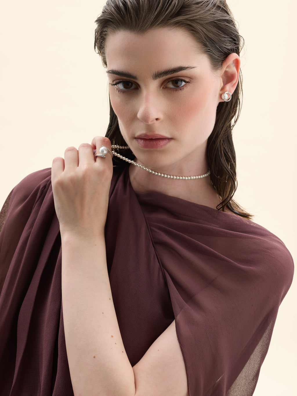 Model wearing a silver and pearl ring