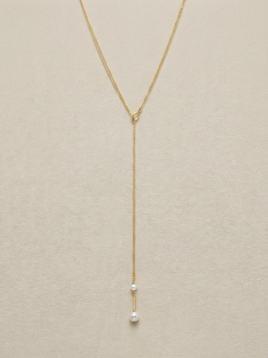 Lange goldene Kettenhalskette mit Perlen