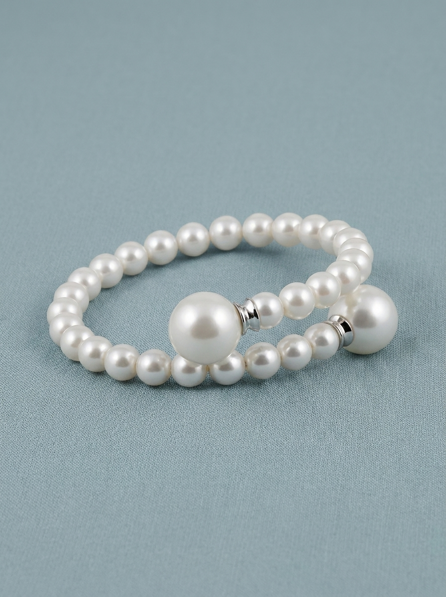 Pulsera rígida con final de perlas grandes