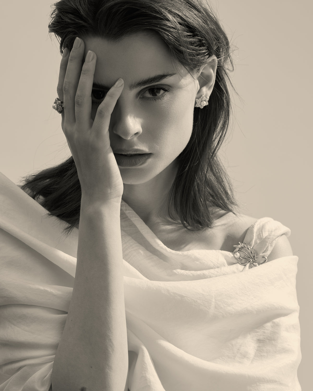 Model wearing a vintage cubic zirconia brooch with a Mallorca pearl