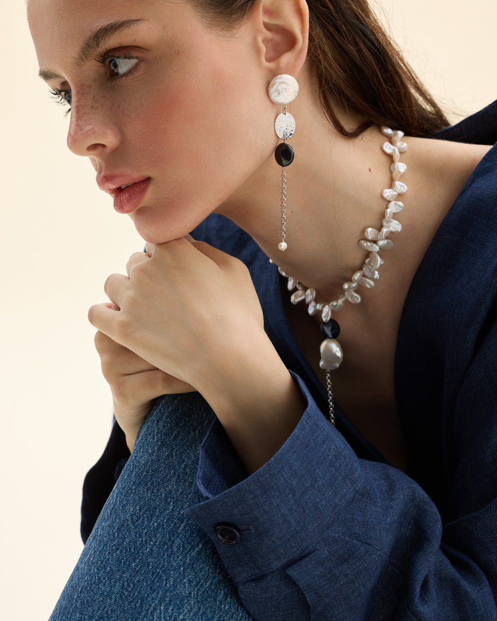 Model wearing a necklace of mixed-shape cultured pearls