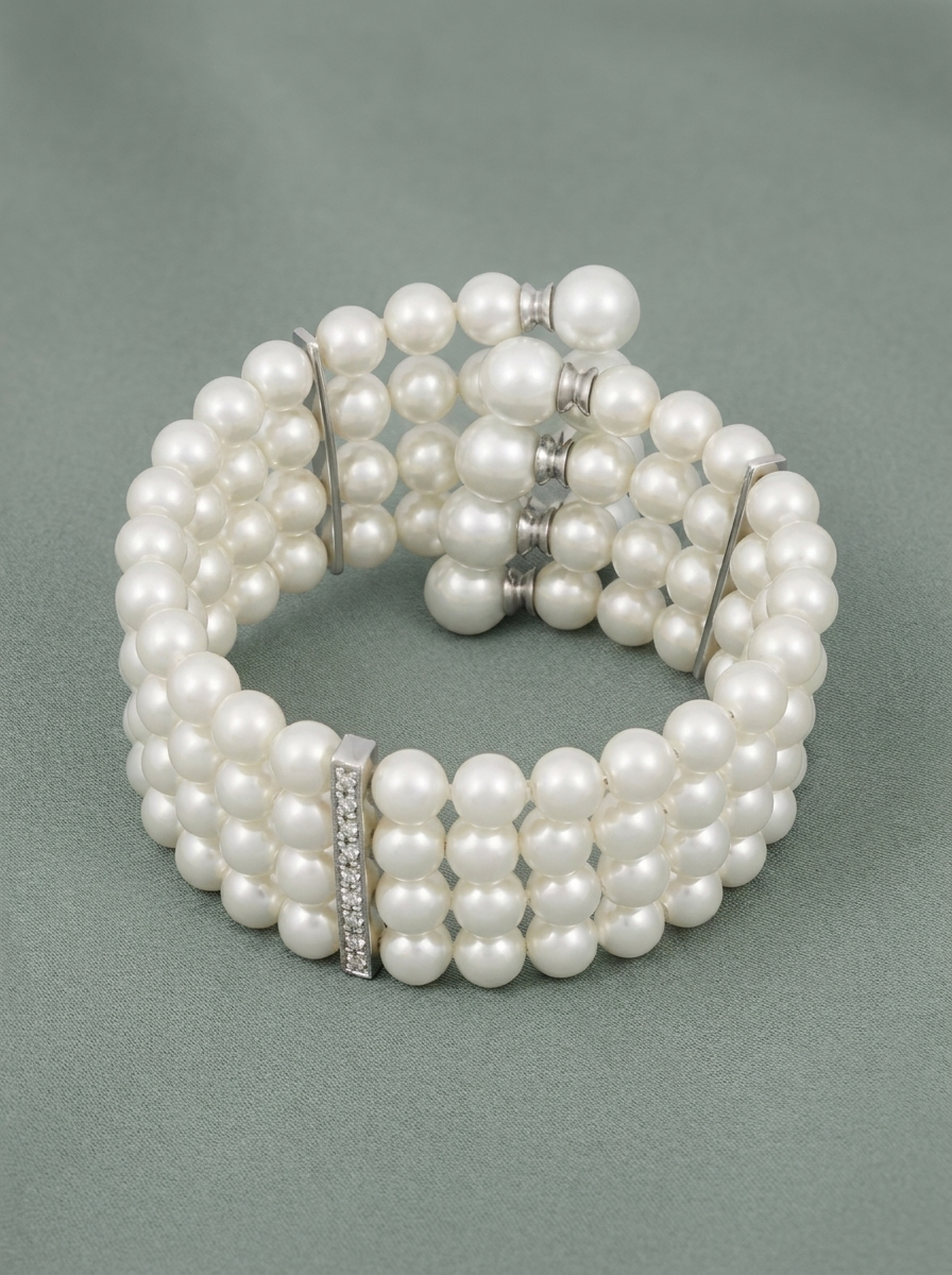 Cuff bracelet with white pearls, cubic zirconia and silver