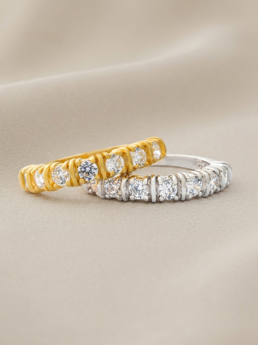 Two identical rings, one in sterling silver and one 18k gold-plated